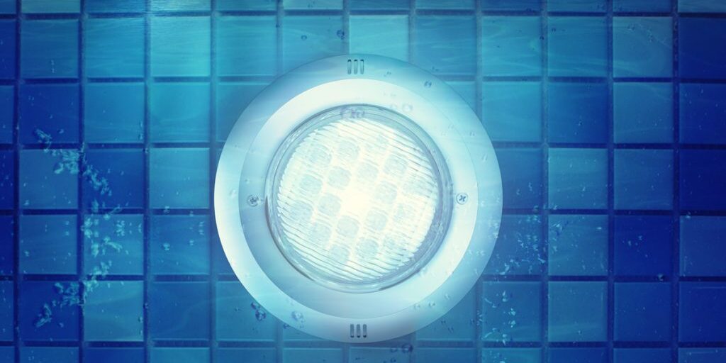 Night scene photo of pool light under water. This image can use for advertising of swimming pool, or house, and much more.